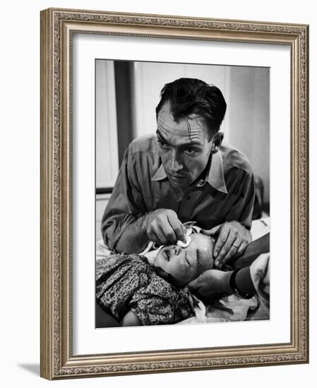 Country Dr. Ernest Ceriani Aftter girl gets stiches from being kicked in head by a Horse-W^ Eugene Smith-Framed Photographic Print