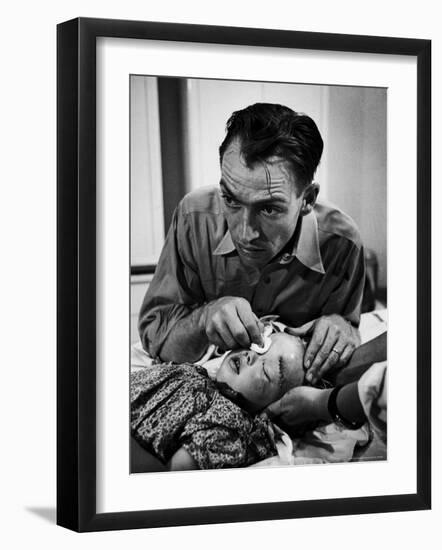 Country Dr. Ernest Ceriani Aftter girl gets stiches from being kicked in head by a Horse-W^ Eugene Smith-Framed Photographic Print