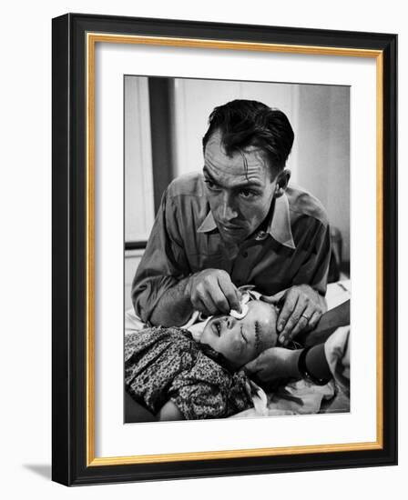 Country Dr. Ernest Ceriani Aftter girl gets stiches from being kicked in head by a Horse-W^ Eugene Smith-Framed Photographic Print