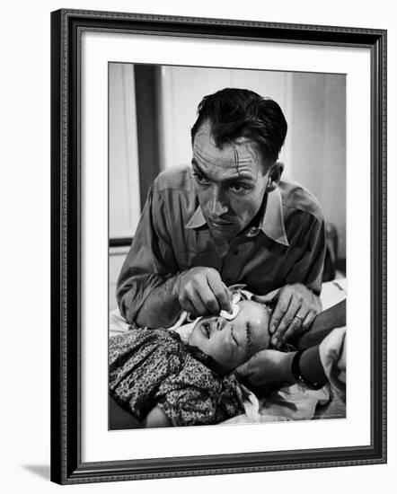 Country Dr. Ernest Ceriani Aftter girl gets stiches from being kicked in head by a Horse-W^ Eugene Smith-Framed Photographic Print