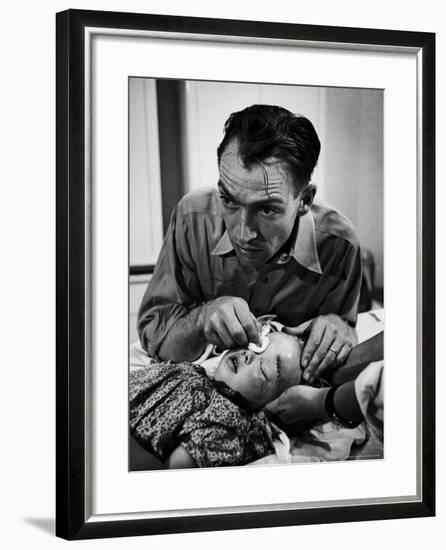 Country Dr. Ernest Ceriani Aftter girl gets stiches from being kicked in head by a Horse-W^ Eugene Smith-Framed Photographic Print