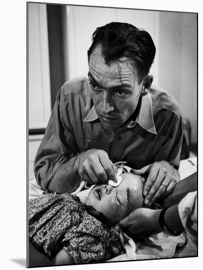 Country Dr. Ernest Ceriani Aftter girl gets stiches from being kicked in head by a Horse-W^ Eugene Smith-Mounted Photographic Print