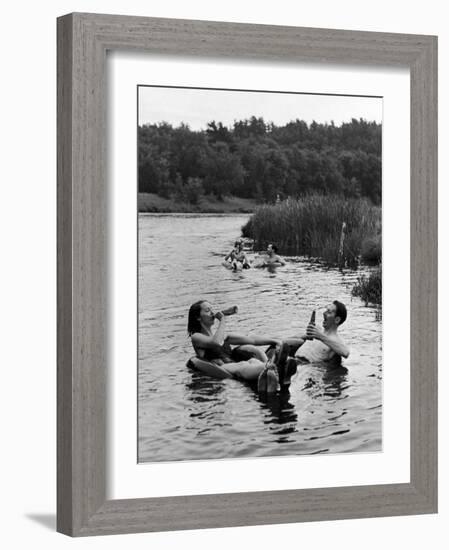 Couple Drinking Beer at Inner Tube Floating Party on the Apple River-Alfred Eisenstaedt-Framed Photographic Print