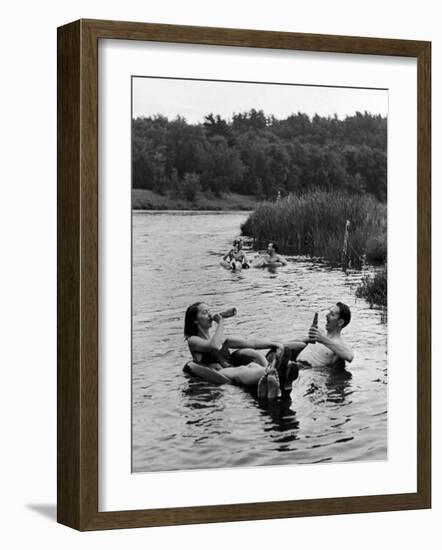 Couple Drinking Beer at Inner Tube Floating Party on the Apple River-Alfred Eisenstaedt-Framed Photographic Print