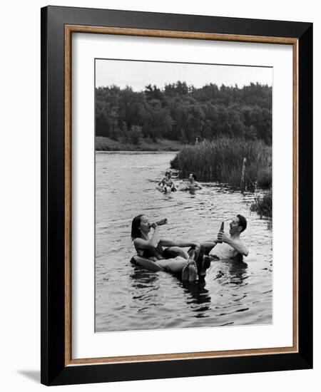 Couple Drinking Beer at Inner Tube Floating Party on the Apple River-Alfred Eisenstaedt-Framed Photographic Print