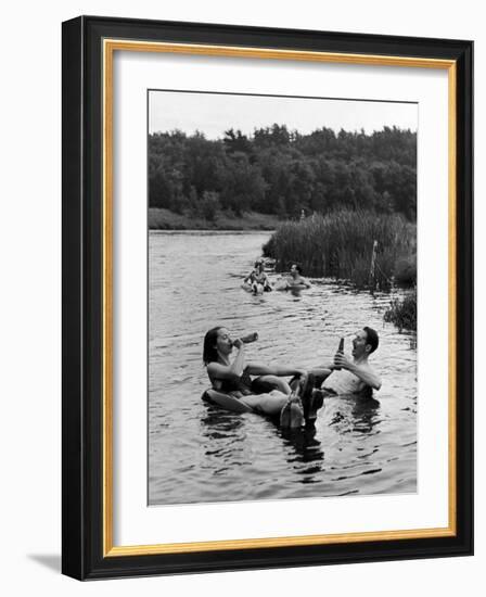 Couple Drinking Beer at Inner Tube Floating Party on the Apple River-Alfred Eisenstaedt-Framed Photographic Print