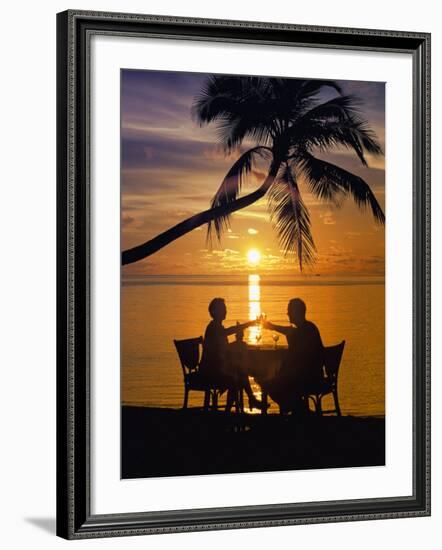 Couple Having Dinner at the Beach, Toasting Glasses, Maldives, Indian Ocean, Asia-Sakis Papadopoulos-Framed Photographic Print