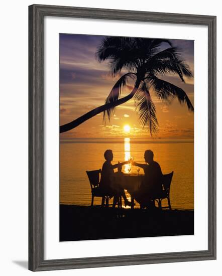 Couple Having Dinner at the Beach, Toasting Glasses, Maldives, Indian Ocean, Asia-Sakis Papadopoulos-Framed Photographic Print