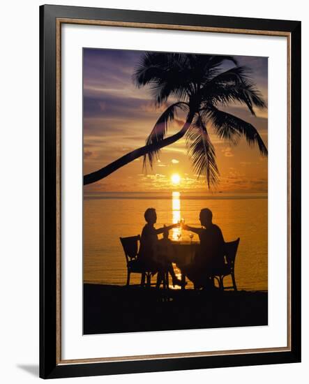 Couple Having Dinner at the Beach, Toasting Glasses, Maldives, Indian Ocean, Asia-Sakis Papadopoulos-Framed Photographic Print