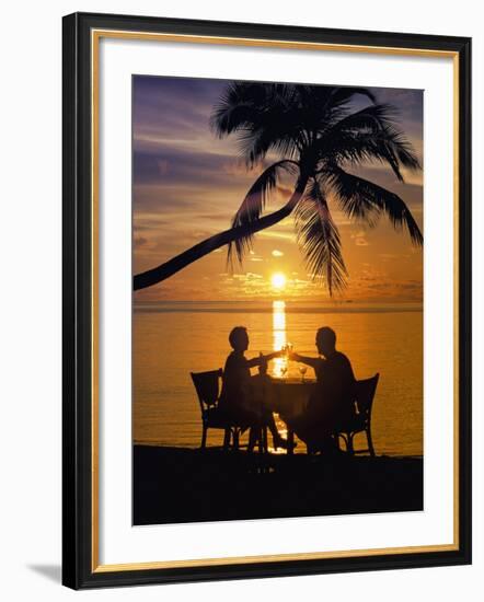 Couple Having Dinner at the Beach, Toasting Glasses, Maldives, Indian Ocean, Asia-Sakis Papadopoulos-Framed Photographic Print