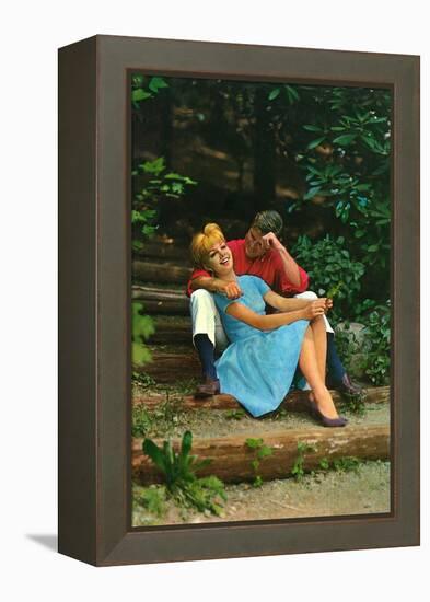Couple in love sitting in a park, 1960s-Italian Photographer-Framed Premier Image Canvas