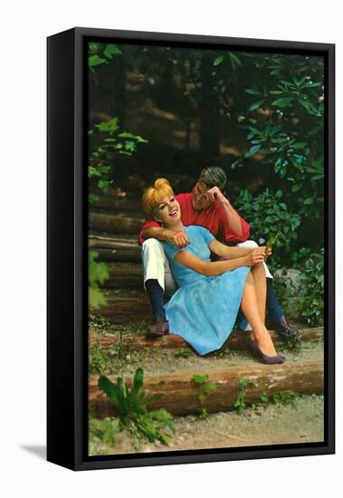 Couple in love sitting in a park, 1960s-Italian Photographer-Framed Premier Image Canvas