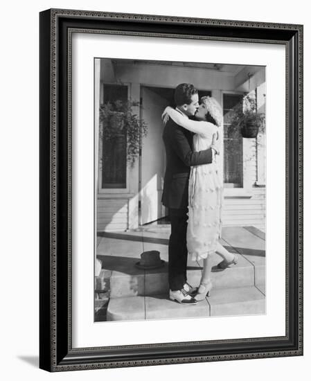 Couple Kissing on Front Porch-null-Framed Photo