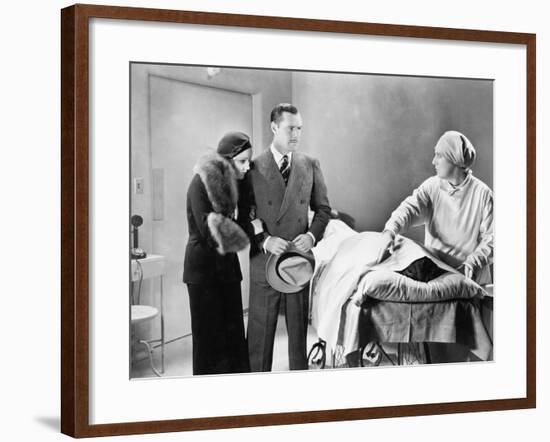 Couple Looking Upset at a Deceased Woman-null-Framed Photo