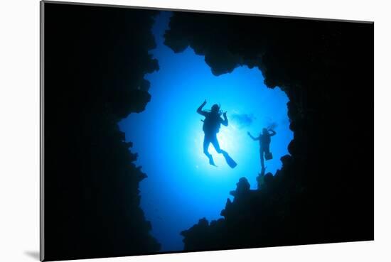 Couple of Scuba Divers Descend into an Underwater Cavern-Rich Carey-Mounted Photographic Print