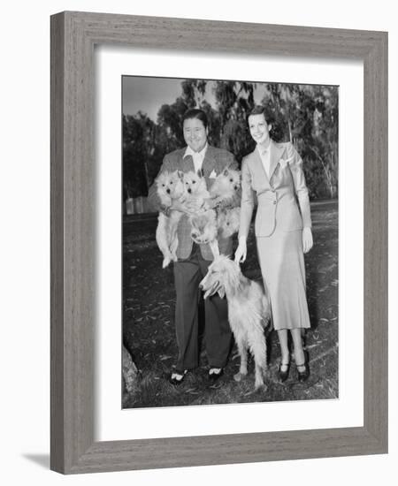 Couple Outside with Dog and Puppies-null-Framed Photo