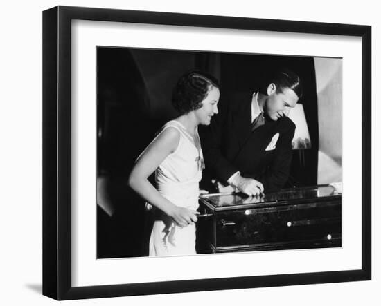 Couple Playing with Pinball Machine-null-Framed Photo