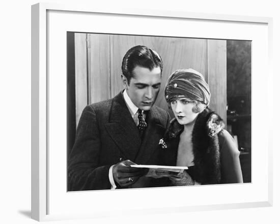 Couple Reading Document Together-null-Framed Photo