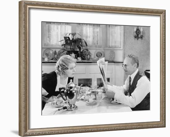 Couple Reading Newspaper at Breakfast Table-null-Framed Photo