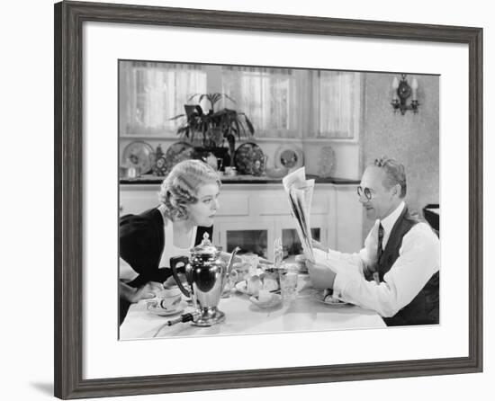 Couple Reading Newspaper at Breakfast Table-null-Framed Photo