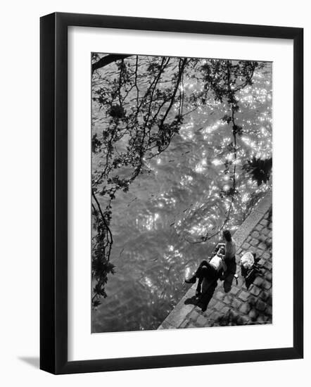 Couple Relaxing on Bank of Seine Near Notre Dame Cathedral During Lunch Hour-Alfred Eisenstaedt-Framed Photographic Print