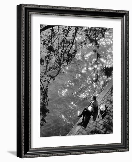 Couple Relaxing on Bank of Seine Near Notre Dame Cathedral During Lunch Hour-Alfred Eisenstaedt-Framed Photographic Print