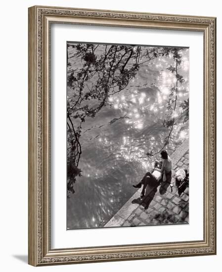 Couple Relaxing on Bank of Seine Near Notre Dame Cathedral During Lunch Hour-Alfred Eisenstaedt-Framed Photographic Print