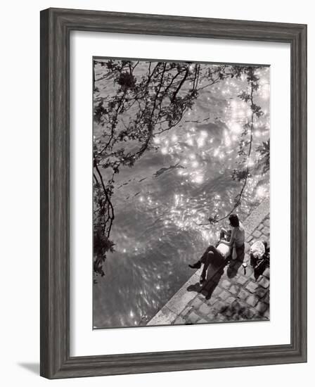 Couple Relaxing on Bank of Seine Near Notre Dame Cathedral During Lunch Hour-Alfred Eisenstaedt-Framed Photographic Print