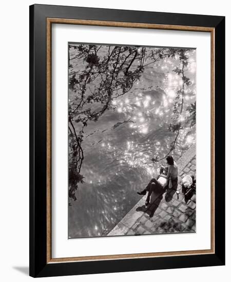 Couple Relaxing on Bank of Seine Near Notre Dame Cathedral During Lunch Hour-Alfred Eisenstaedt-Framed Photographic Print