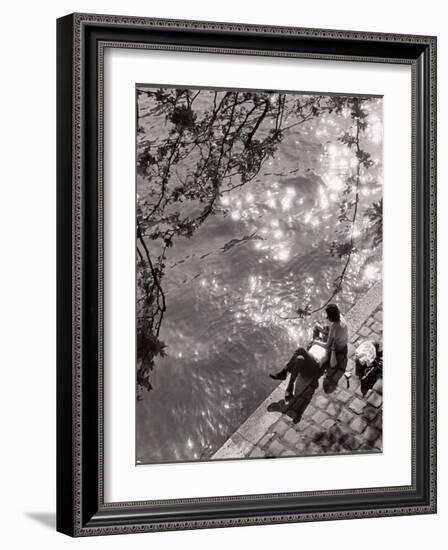 Couple Relaxing on Bank of Seine Near Notre Dame Cathedral During Lunch Hour-Alfred Eisenstaedt-Framed Photographic Print