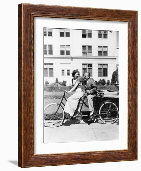 Couple Riding Tandem Bike-null-Framed Photo