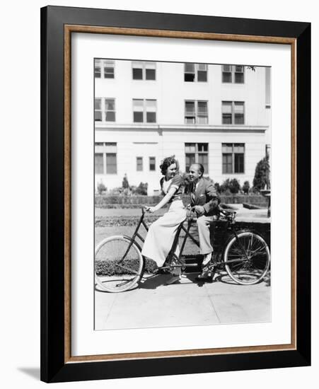 Couple Riding Tandem Bike-null-Framed Photo