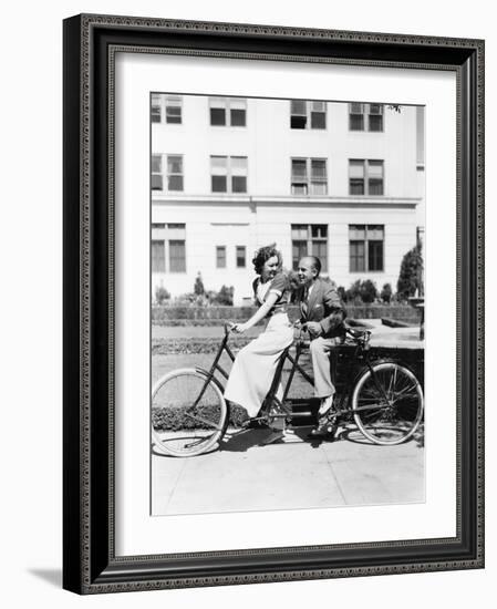 Couple Riding Tandem Bike-null-Framed Photo