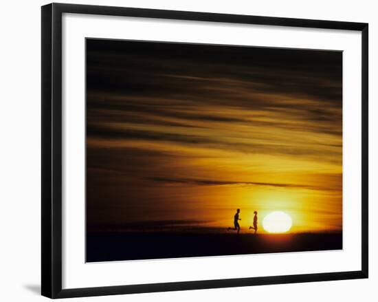 Couple Running at Sunset-null-Framed Photographic Print