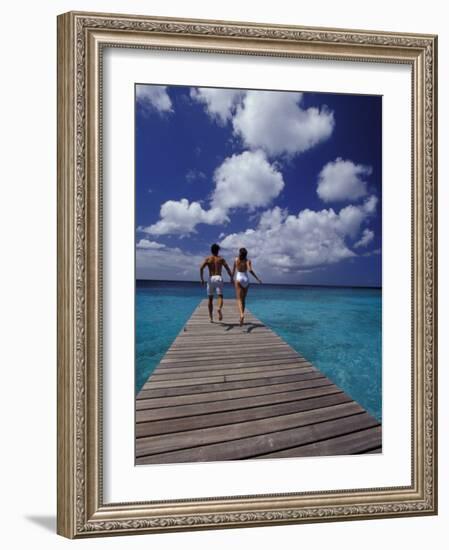 Couple Running on Dock, Curacao, Caribbean-Greg Johnston-Framed Photographic Print