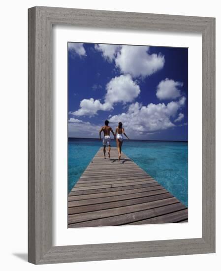 Couple Running on Dock, Curacao, Caribbean-Greg Johnston-Framed Photographic Print