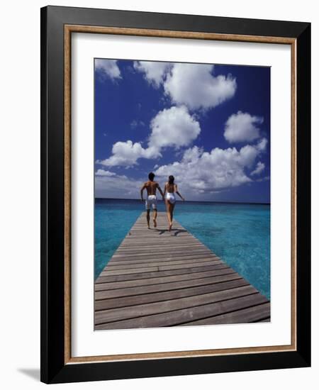 Couple Running on Dock, Curacao, Caribbean-Greg Johnston-Framed Photographic Print