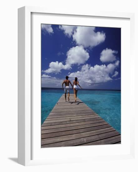 Couple Running on Dock, Curacao, Caribbean-Greg Johnston-Framed Photographic Print