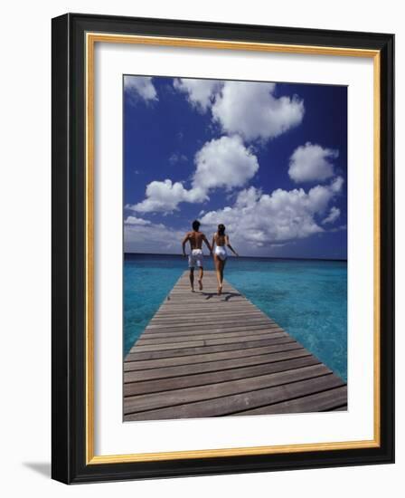 Couple Running on Dock, Curacao, Caribbean-Greg Johnston-Framed Photographic Print