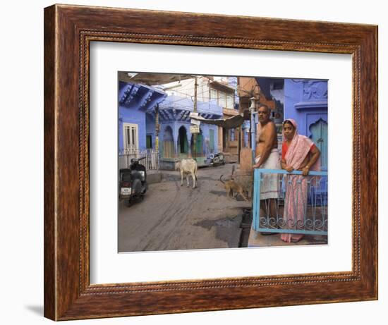 Couple Standing Outside Blue Painted Residential Haveli, Old City, Jodhpur, Rajasthan State, India-Eitan Simanor-Framed Photographic Print