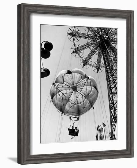 Couple Taking a Ride on the 300 Ft. Parachute Jump at Coney Island Amusement Park-Marie Hansen-Framed Photographic Print