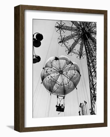 Couple Taking a Ride on the 300 Ft. Parachute Jump at Coney Island Amusement Park-Marie Hansen-Framed Photographic Print