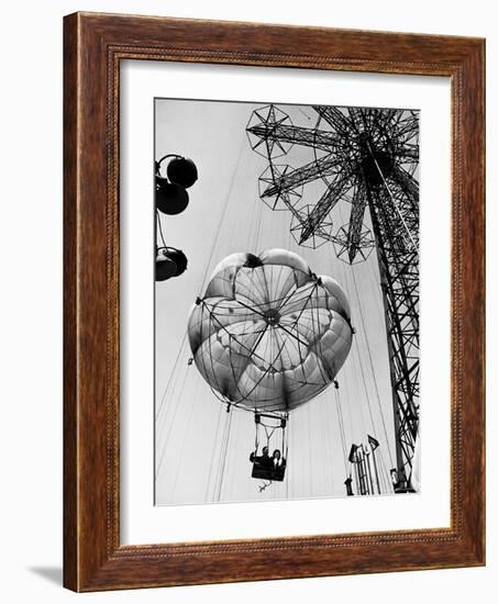 Couple Taking a Ride on the 300 Ft. Parachute Jump at Coney Island Amusement Park-Marie Hansen-Framed Photographic Print