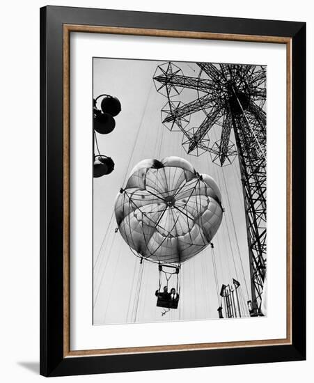 Couple Taking a Ride on the 300 Ft. Parachute Jump at Coney Island Amusement Park-Marie Hansen-Framed Photographic Print