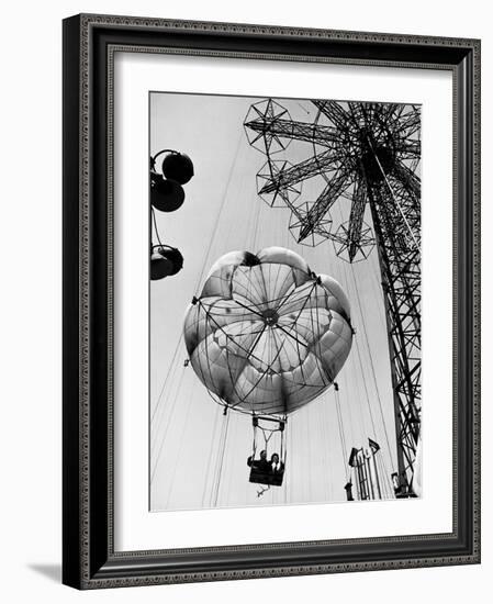 Couple Taking a Ride on the 300 Ft. Parachute Jump at Coney Island Amusement Park-Marie Hansen-Framed Photographic Print