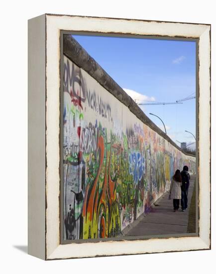 Couple Walking Along the East Side Gallery Berlin Wall Mural, Berlin, Germany, Europe-Simon Montgomery-Framed Premier Image Canvas