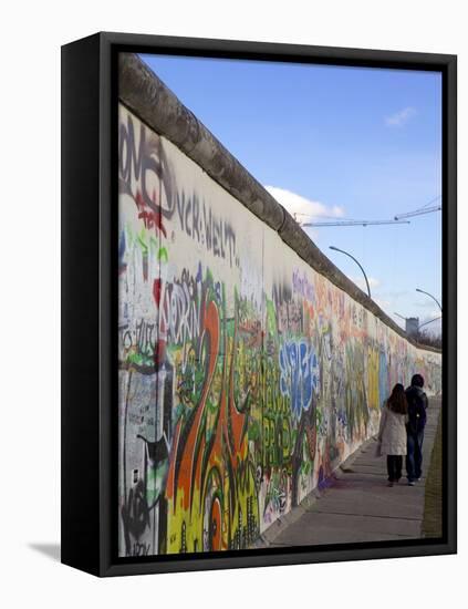 Couple Walking Along the East Side Gallery Berlin Wall Mural, Berlin, Germany, Europe-Simon Montgomery-Framed Premier Image Canvas