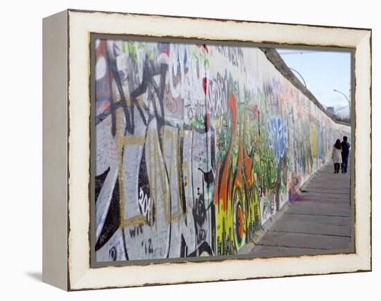 Couple Walking Along the East Side Gallery Berlin Wall Mural, Berlin, Germany, Europe-Simon Montgomery-Framed Premier Image Canvas