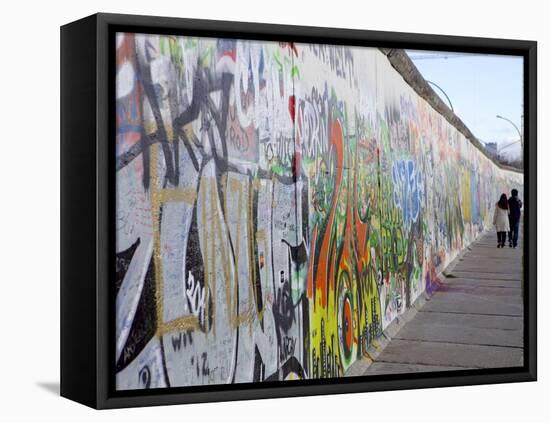 Couple Walking Along the East Side Gallery Berlin Wall Mural, Berlin, Germany, Europe-Simon Montgomery-Framed Premier Image Canvas