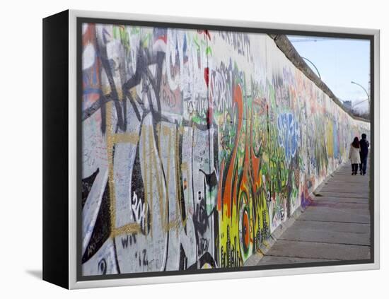 Couple Walking Along the East Side Gallery Berlin Wall Mural, Berlin, Germany, Europe-Simon Montgomery-Framed Premier Image Canvas